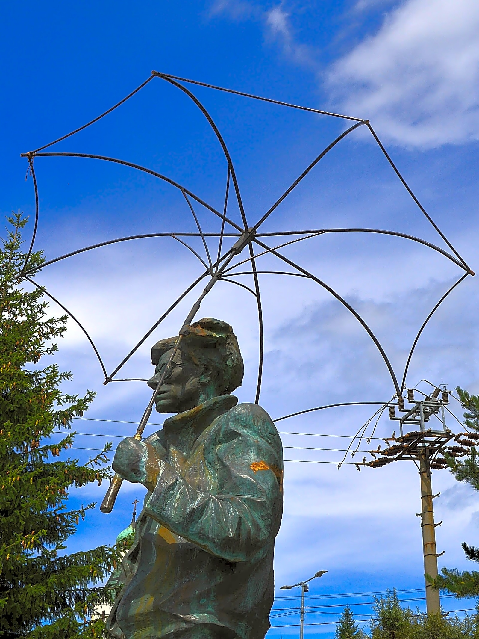 Pintura pop a óleo retratando Andy Warhol em frente a uma fábrica de produção de arte em tons de rosa e cinza.